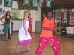 Our chef, Denise, dances with Moustapha