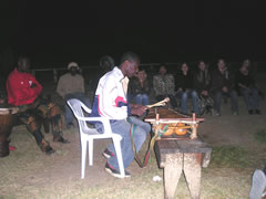 Lansana playing balafon at the fire